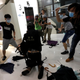 Pro-democracy activists hit a plainclothes police officer in a Hong Kong mall, July 14, 2019.